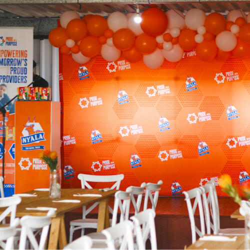 9 Yard Marketing - Product Launches 9 Yard Marketing product launch event with branded backdrop and balloons.