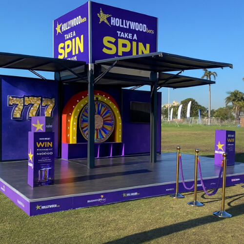 9 Yard Marketing - Show Stands 9 Yard Marketing custom show stand structure at an outdoor event.